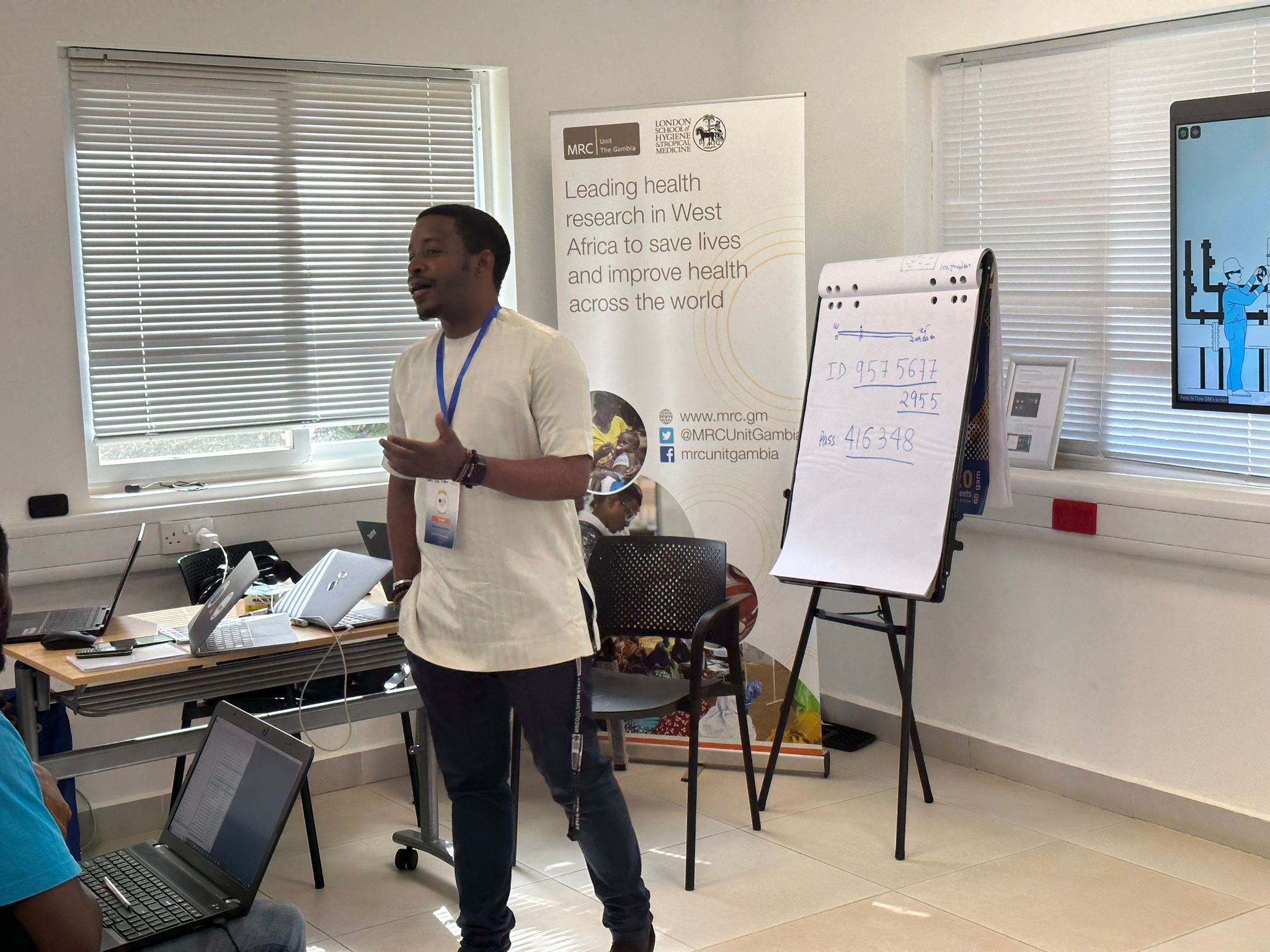 Photo of Peter S Ndow presenting a workshop.