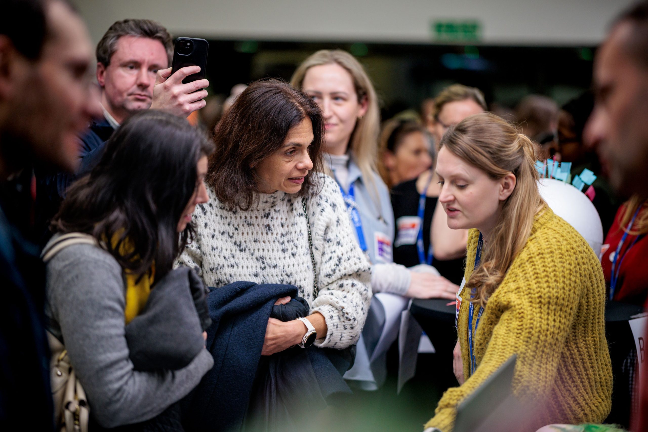 Photograph of MUSICC staff and members of the public in conversation.