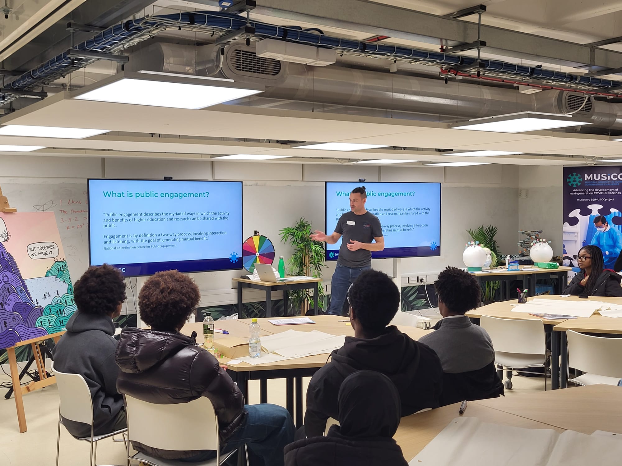 Photograph of a MUSICC staff member presenting the STEM Futures workshop to Year 12 students.