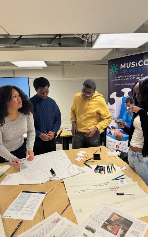 Photograph of Year 12 students working together on their t-shirt design.