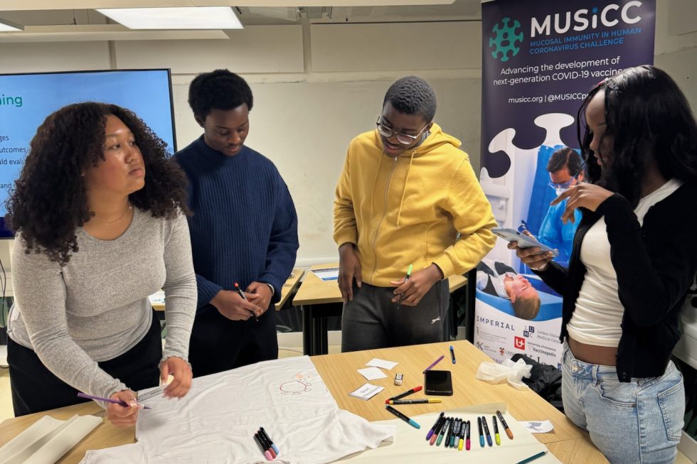 Photograph of Year 12 students working together on their t-shirt design.